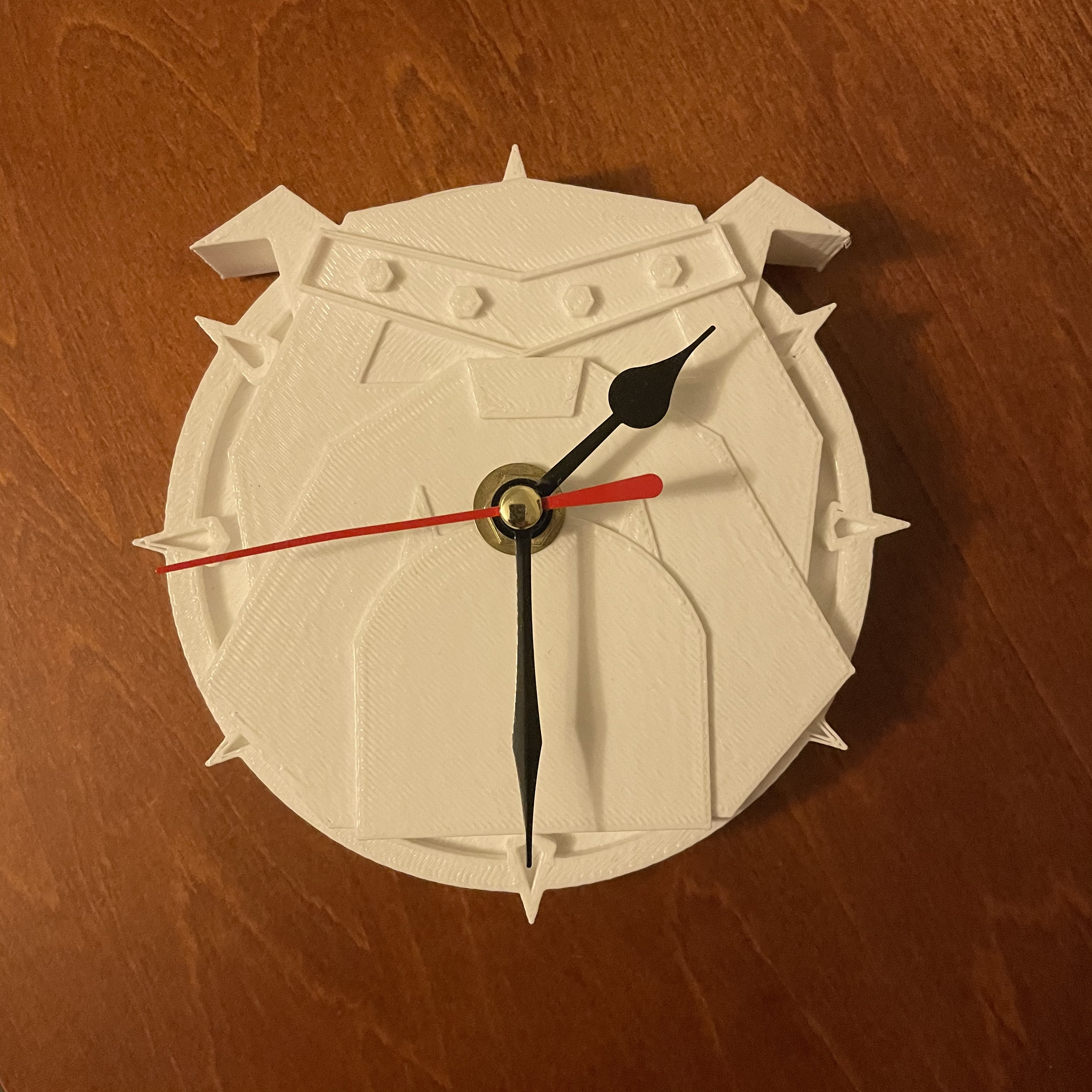 Picture of a clock in the shape of the TechnoDogs logo