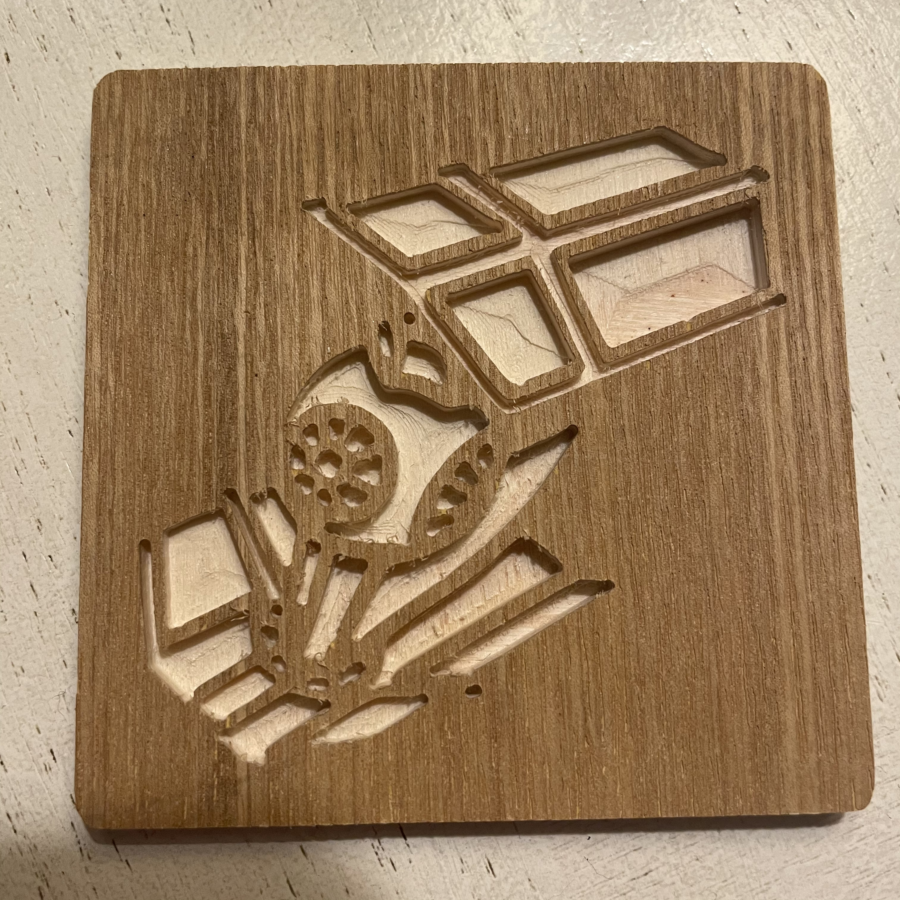 Picture of a TIE fighter carved into a beverage coaster